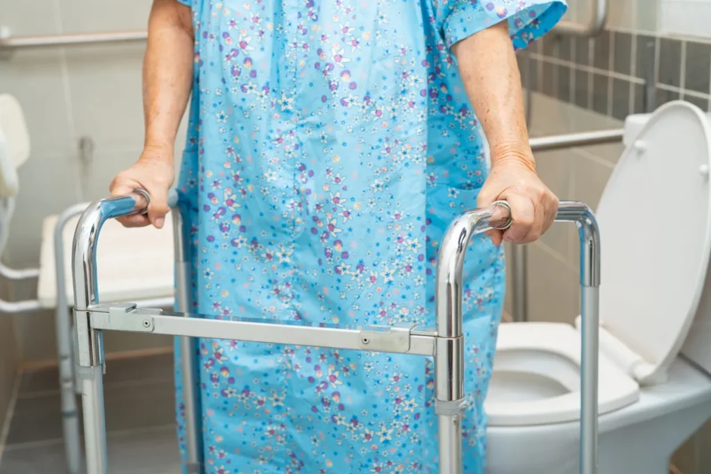 Image of an elderly chemotherapy patient coming from the bathroom, illustrating symptoms like chemotherapy-induced diarrhea, managing chemotherapy-induced diarrhea, and diarrhea side effects of chemotherapy.